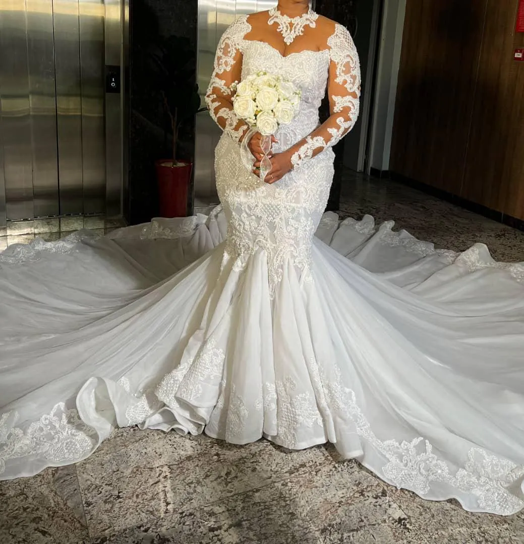 Wedding dress with full length veil and bouquet